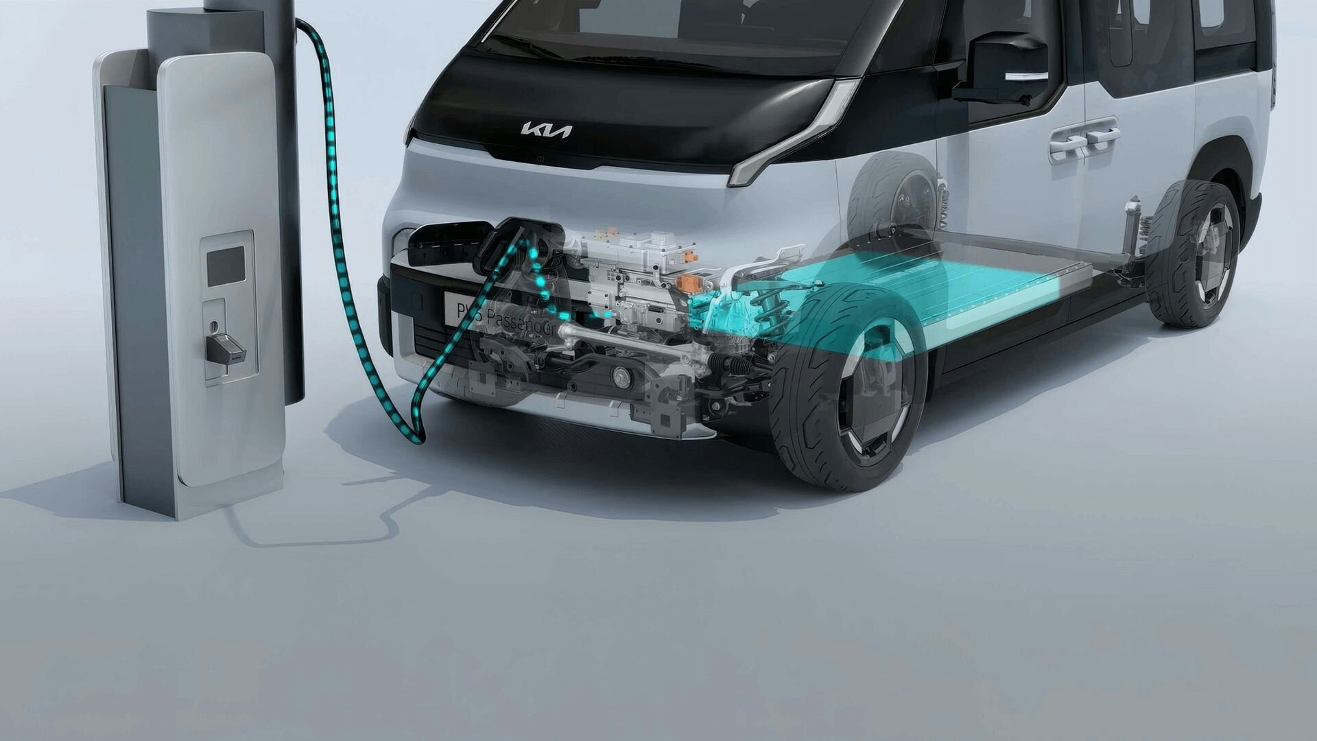 Nahaufnahme des vorderen Ladeanschlusses des Kia PV5 Passenger mit verbundenem Kabel